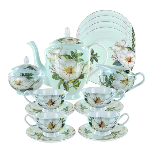 Tea set with floral design on a white background