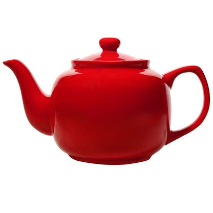 A bright red ceramic teapot with a lid and spout, suitable for making tea.